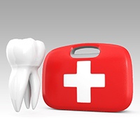 Tooth next to a dental emergency kit