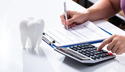 Patient in St. Albans budgeting for dental crowns